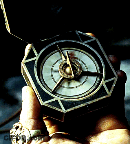 A Person Is Holding A Compass In Their Hand And It Shows The Time As Almost 3:00 GIF