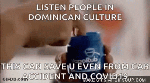 A Person Is Holding A Container Of Vaporub In Their Hands . GIF