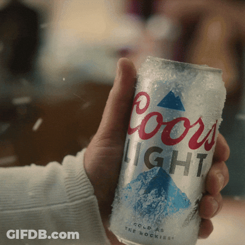 A Person Is Holding A Coors Light Can In Their Hand GIF