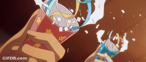 A Person Is Holding A Cup With A Star On It And Confetti Coming Out Of It GIF