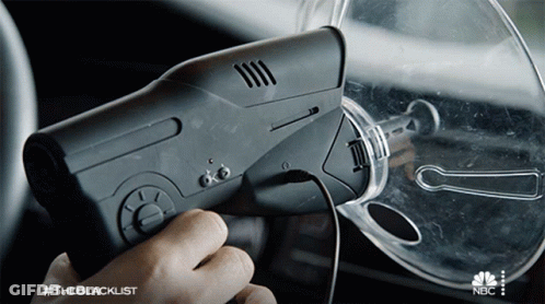 A Person Is Holding A Device That Says #Theblacklist On The Bottom GIF