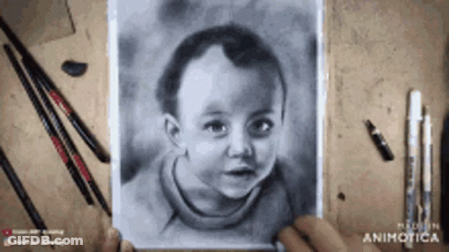 A Person Is Holding A Drawing Of A Child 'S Face GIF