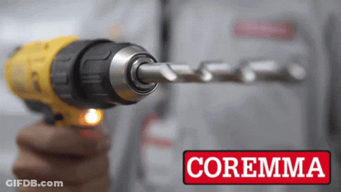 A Person Is Holding A Drill With The Word Coremma On The Bottom Right GIF