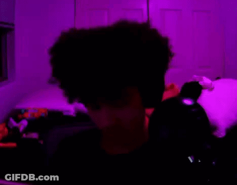 A Person Is Holding A Fan Of Twenty Dollar Bills In Their Hand GIF