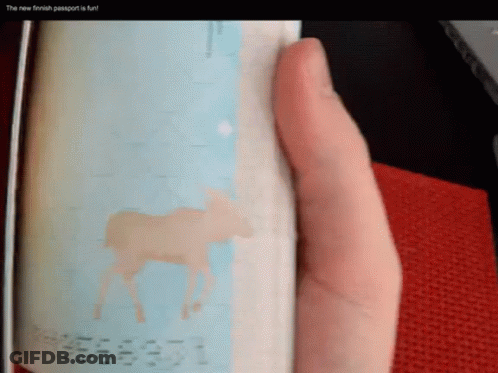 A Person Is Holding A Finnish Passport With A Moose On It GIF