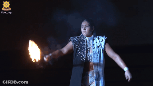 A Person Is Holding A Fireball In Front Of A Sign That Says ' Captain Star ' GIF