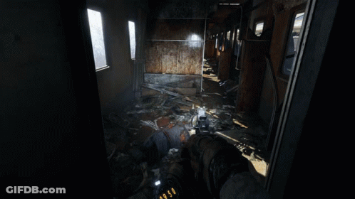 A Person Is Holding A Gun In A Room With A Ladder And A Chair GIF