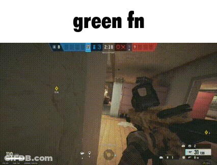 A Person Is Holding A Gun In A Video Game And The Word Green Is On The Bottom . GIF
