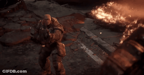 A Person Is Holding A Gun In Front Of A Bright Light . GIF