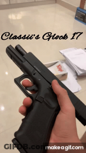 A Person Is Holding A Gun With The Words Classii 'S Glock 17 On The Bottom GIF