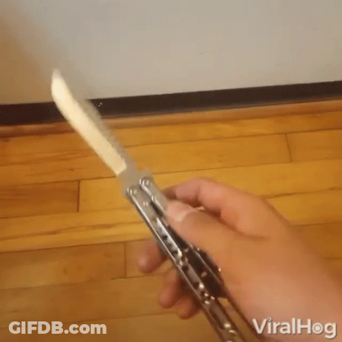 A Person Is Holding A Knife With The Word Viralhog On The Bottom Left GIF