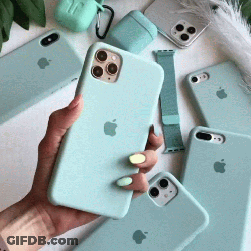 A Person Is Holding A Light Blue Apple Phone In Their Hand GIF