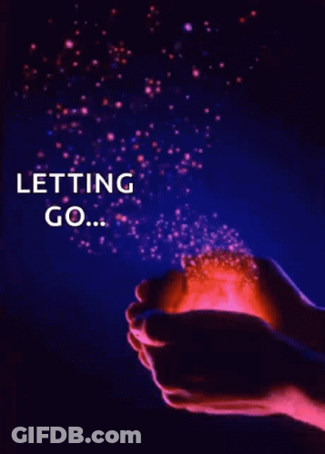 A Person Is Holding A Light In Their Hands With The Words Letting Go Written On It GIF