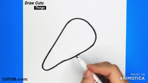 A Person Is Holding A Marker And Drawing A Circle On A Piece Of Paper . GIF