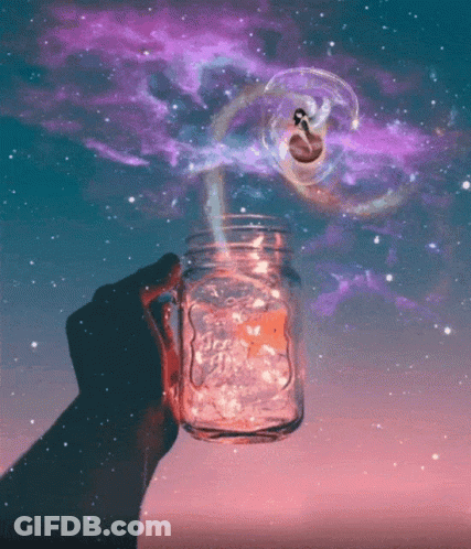 A Person Is Holding A Mason Jar With A Starry Sky Behind It GIF
