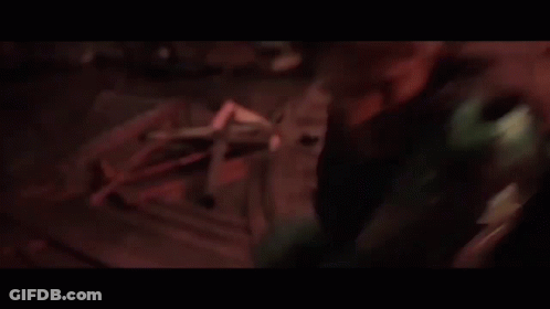 A Person Is Holding A Pair Of Scissors In Their Right Hand GIF