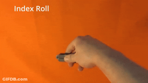 A Person Is Holding A Pair Of Scissors With The Words Index Roll Written Above Them GIF