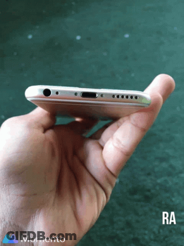 A Person Is Holding A Phone In Their Hand And The Bottom Of The Phone Is Visible GIF