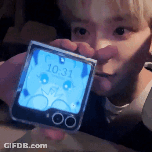 A Person Is Holding A Phone That Says 10:31 On It GIF