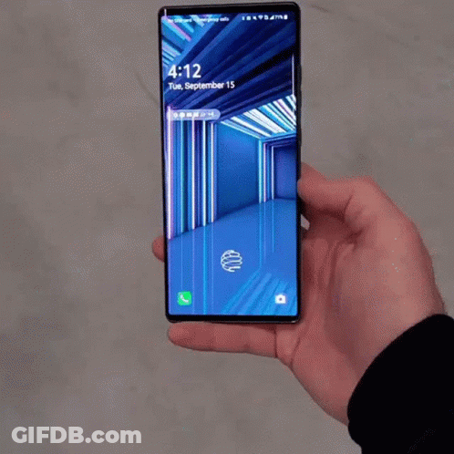 A Person Is Holding A Phone That Says 4:12 Tuesday September 15Th GIF