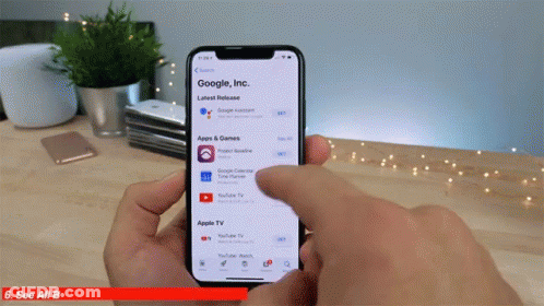 A Person Is Holding A Phone That Says Google Inc. GIF