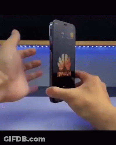 A Person Is Holding A Phone That Says Huawei On It GIF