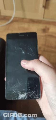 A Person Is Holding A Phone With A Broken Screen GIF