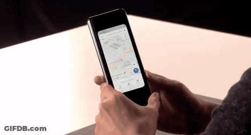 A Person Is Holding A Phone With A Map On It GIF