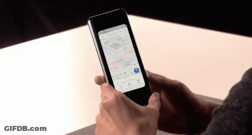 A Person Is Holding A Phone With A Map On It GIF