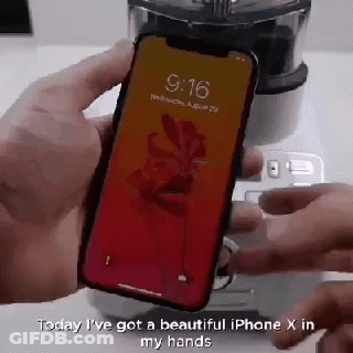 A Person Is Holding A Phone With The Time Of 9:16 On It GIF