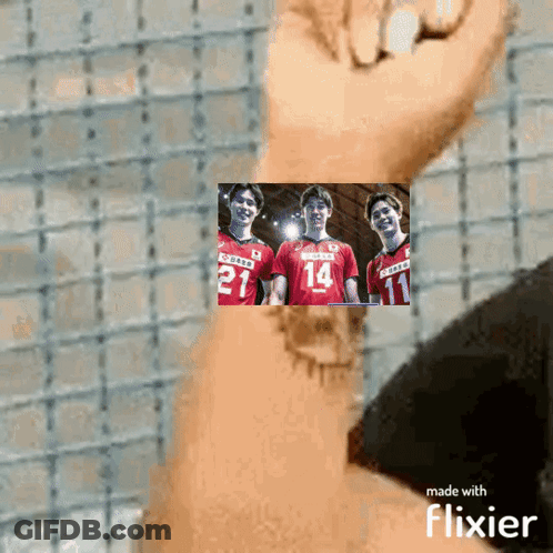 A Person Is Holding A Picture Of Three Volleyball Players With The Number 14 On Their Jersey GIF