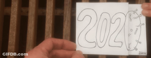 A Person Is Holding A Piece Of Paper That Says ' 2021 ' On It GIF
