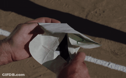 A Person Is Holding A Piece Of Paper That Says I Am On It GIF
