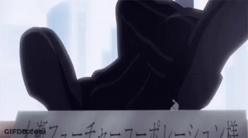 A Person Is Holding A Piece Of Paper With Japanese Writing On It . GIF