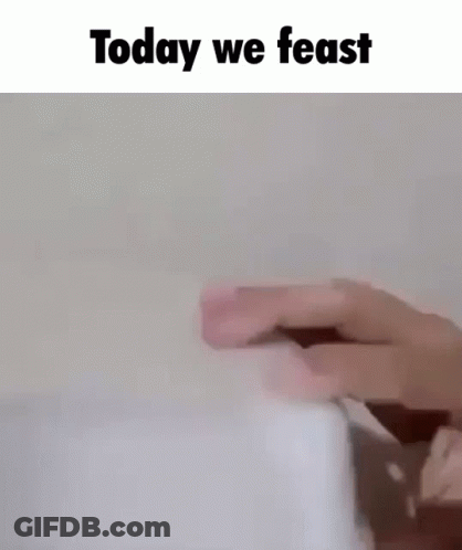 A Person Is Holding A Piece Of Paper With The Words `` Today We Feast '' Written Above It . GIF