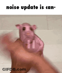 A Person Is Holding A Pink Pig In Their Hand And Says Noise Update Is Can . GIF