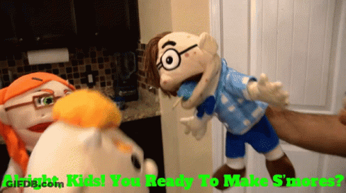 A Person Is Holding A Puppet That Says ' Alright Kids You Ready To Make S'mores ' On It GIF