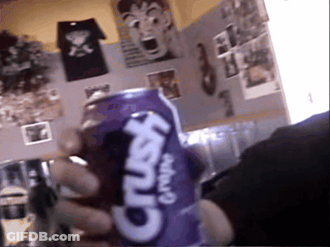 A Person Is Holding A Purple Crush Grape Soda GIF