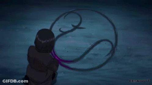 A Person Is Holding A Purple Object In Their Hand In A Purple Light . GIF