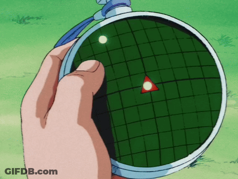 A Person Is Holding A Radar That Has A Red Triangle In The Center GIF