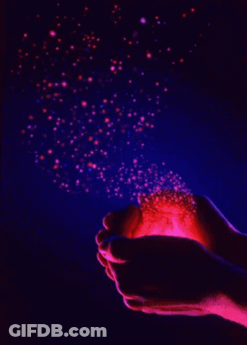 A Person Is Holding A Red Object In Their Hands GIF