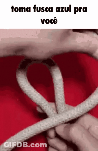 A Person Is Holding A Rope In Their Hands And Making A Heart Shape . GIF