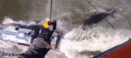 A Person Is Holding A Rope Over A Boat That Says ' Rescue ' On The Side GIF