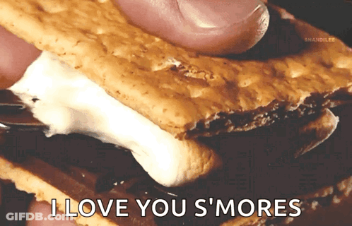 A Person Is Holding A S'more With The Words " I Love You S'mores " On The Bottom GIF