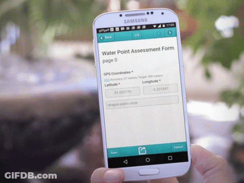 A Person Is Holding A Samsung Cell Phone With A Water Point Assessment Form On The Screen GIF