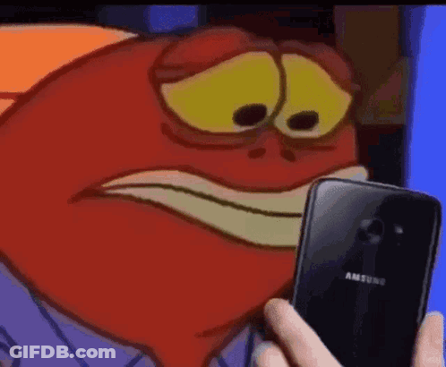 A Person Is Holding A Samsung Phone In Front Of A Red Cartoon Character . GIF
