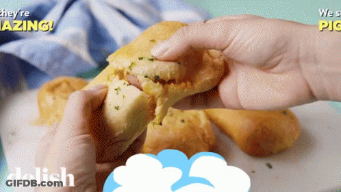 A Person Is Holding A Sandwich With The Words They 'Re Amazing On The Bottom GIF