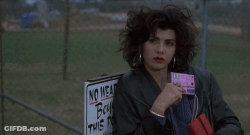 A Person Is Holding A Sign That Says No Wear Boys On It GIF
