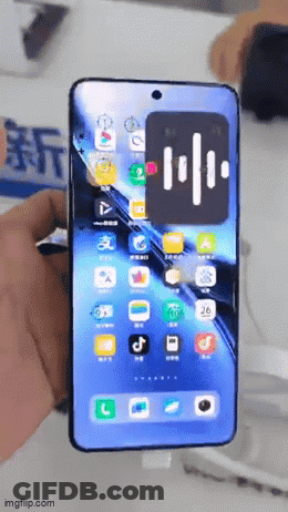 A Person Is Holding A Smart Phone With A Screen That Says Imgflip.com On It GIF