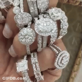 Person Holding Stack Of Diamonds GIF